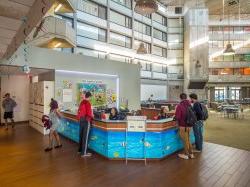 The front desk at Blanton Hall with some students milling about.