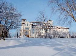 University Hall and nearby campus area in snow.